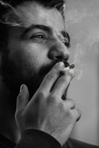 Close-up of man smoking cigarette