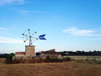 Traditional windmill on landscape