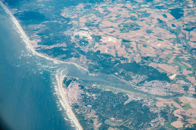 Aerial view of sea seen through airplane window