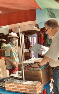 People at market stall