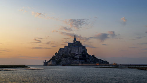 Panoramic view of the famous abbey of le mont saint-michel at sunset, normandy, france