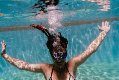 Man swimming in pool