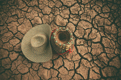 High angle view of wicker basket on sand