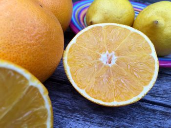 Close-up of oranges on wooden table