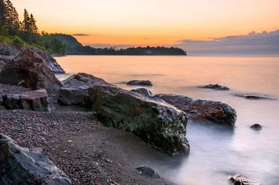 Scenic view of sea against sky during sunset