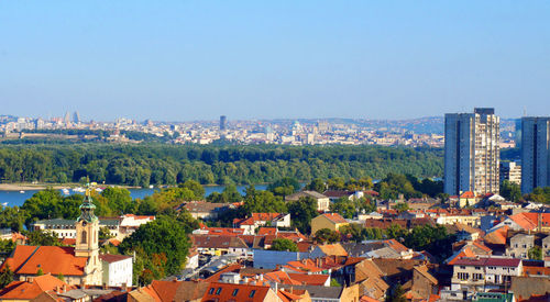 High angle view of cityscape against clear blue sky