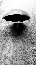 High angle view umbrella on wet street