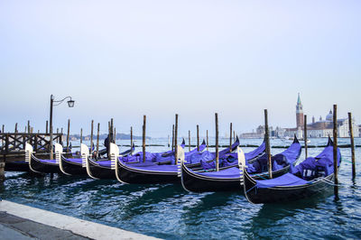 Boats moored at dock