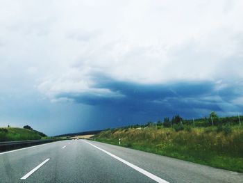 Empty road passing through landscape
