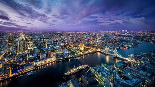 High angle view of illuminated city buildings at night