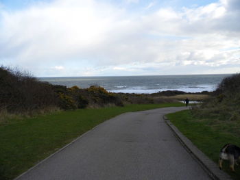 Scenic view of sea against cloudy sky