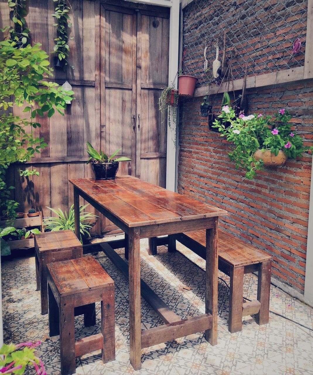 seat, chair, table, plant, wood - material, architecture, potted plant, no people, built structure, house, building, building exterior, absence, nature, empty, day, furniture, growth, wall, bench, wood, outdoors, brick, flower pot