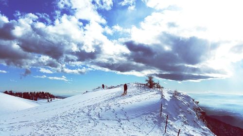 Scenic view of snow covered mountain against sky