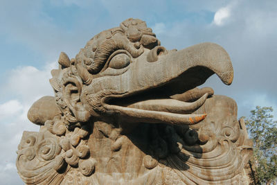 Low angle view of statue against sky garuda wisnu kencana bali