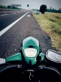 Cropped image of bicycle on road