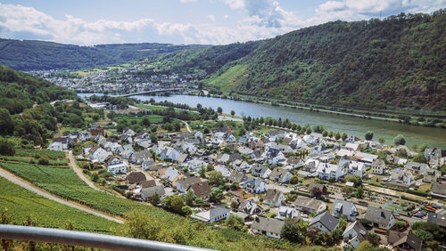 High angle view of townscape and mountains against sky