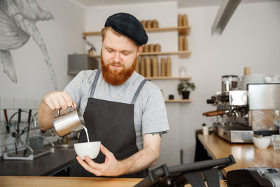 Young man having coffee in cafe