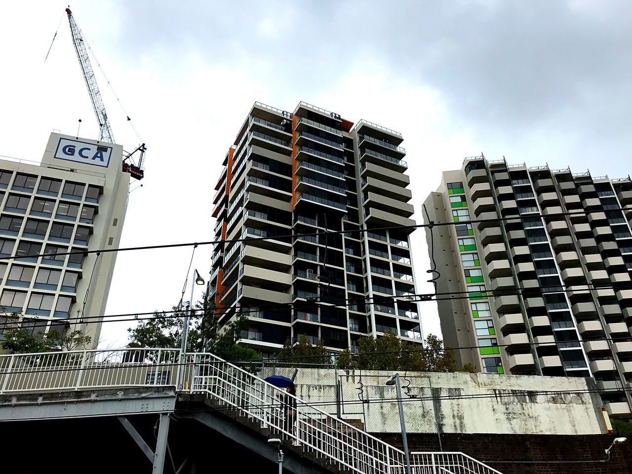 LOW ANGLE VIEW OF OFFICE BUILDINGS AGAINST SKY