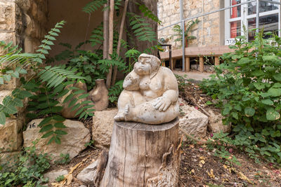 Statue against trees