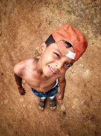 High angle portrait of happy boy smiling