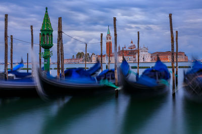 Boats moored at harbor