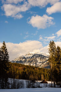 Scenic view of snow covered mountains against sky