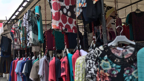 Clothes hanging in store for sale