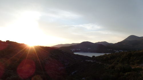 Sun shining over calm lake