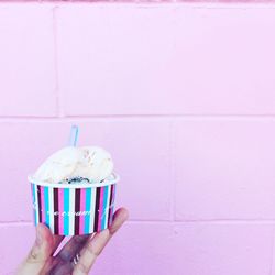 Close-up of hand holding ice cream