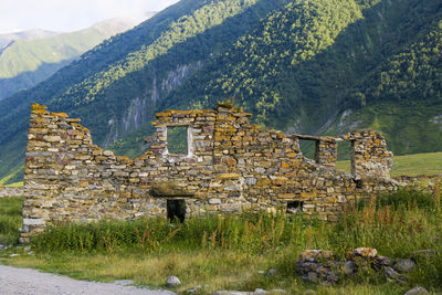 Old building ruins, sightseeing in georgia, khazbegi. stone house and architecture. 