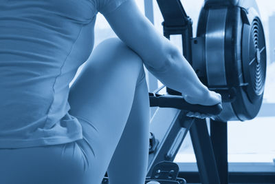 Midsection of woman exercising in gym