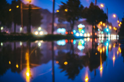 Reflection of illuminated buildings in water