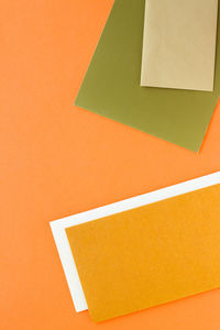 High angle view of yellow papers on table