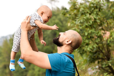 Father holding baby