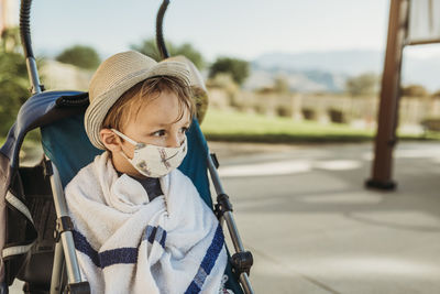 Portrait of cute boy in car