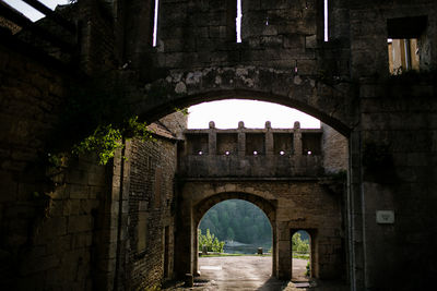 Arched entryway through wall in flavigny france