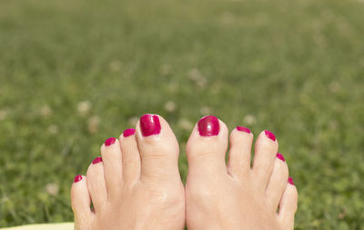 Low section of woman legs against blurred background