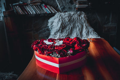 High angle view of red flower on table