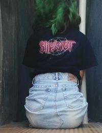 Rear view of woman standing outdoors