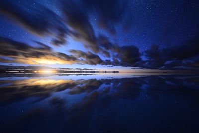 Scenic view of sea against sky at dusk