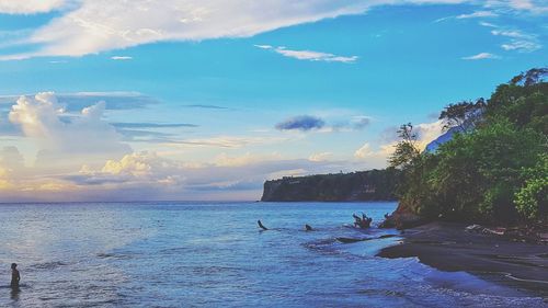 Scenic view of sea against sky at sunset