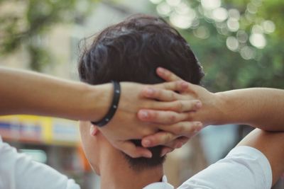 Close-up of couple holding hands