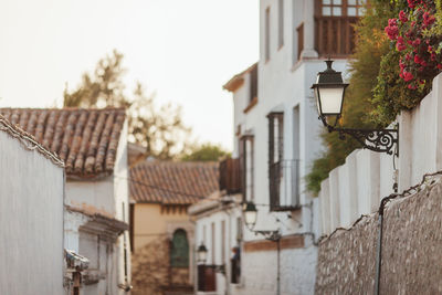 Houses in town against sky