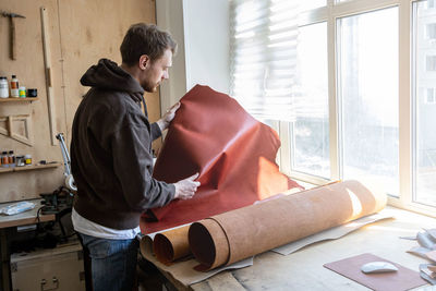 Side view of man working at home