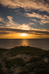 Scenic view of beach during sunset