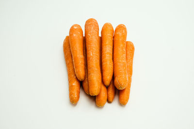High angle view of carrots on white background