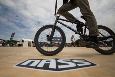 Low section of man riding bicycle