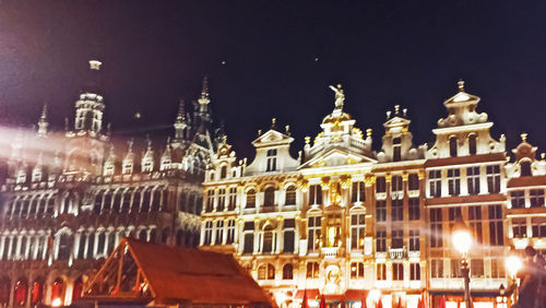 Low angle view of illuminated buildings at night