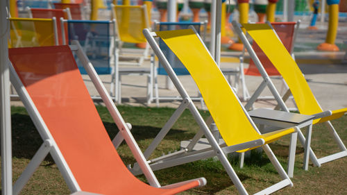 Empty chairs and tables in park