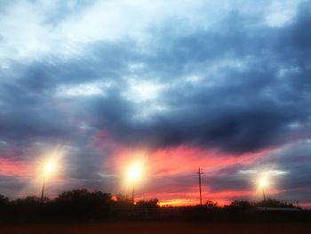 Silhouette of landscape against cloudy sky